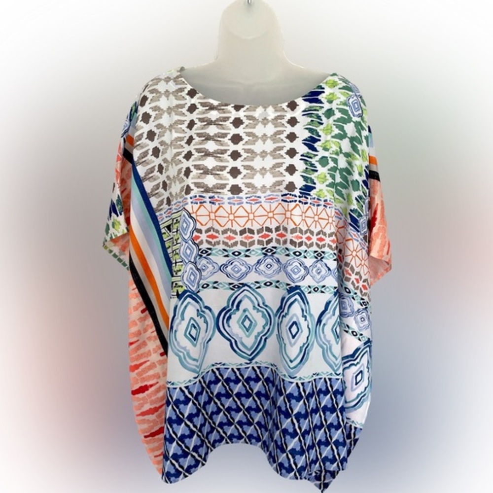Top, flowy with arm holes patterned top.